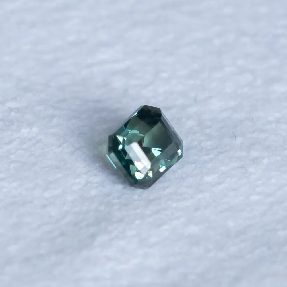 1.26CT EMERALD CUT MADAGASCAR SAPPHIRE, TEAL TO GREY, 5.7X4.79X4.44MM