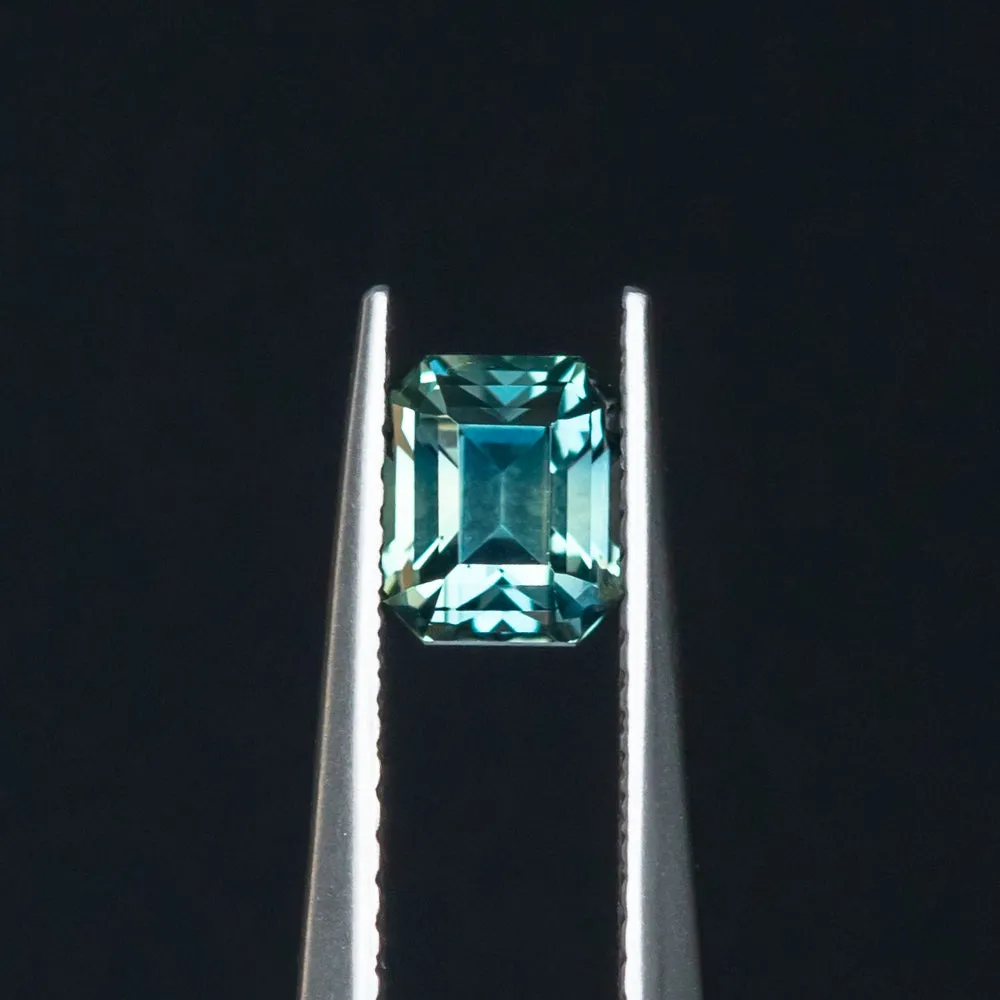 1.26CT EMERALD CUT MADAGASCAR SAPPHIRE, TEAL TO GREY, 5.7X4.79X4.44MM