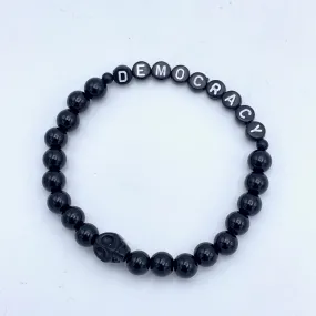 Black obsidian and howlite gemstone skull Democracy bracelet