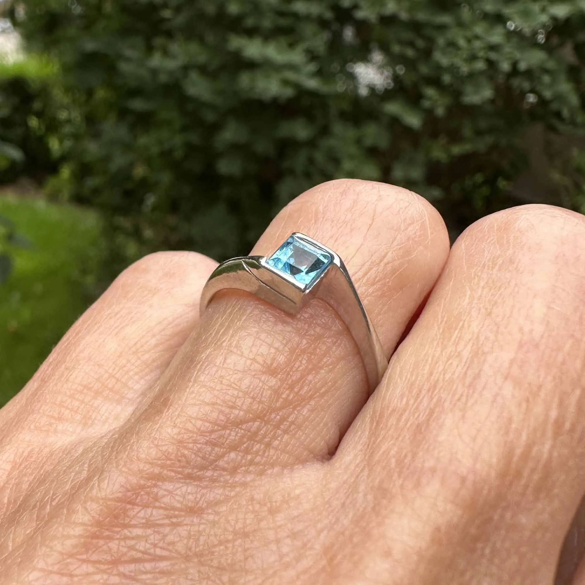 Bypass 10K White Gold Emerald Cut Blue Topaz Ring