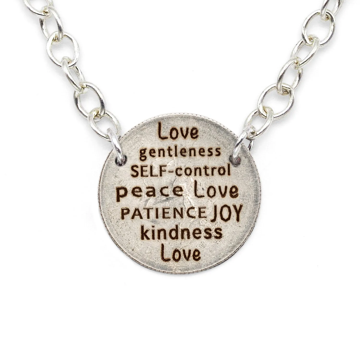 Sure! Here’s an optimized title for the e-commerce product:

Sterling Silver Quarter Statement Necklace with Mariamor Kindness, Love, Joy, and Patience Charm

This title includes modifiers that highlight the material, the style of the necklace, and the specific charms it features.