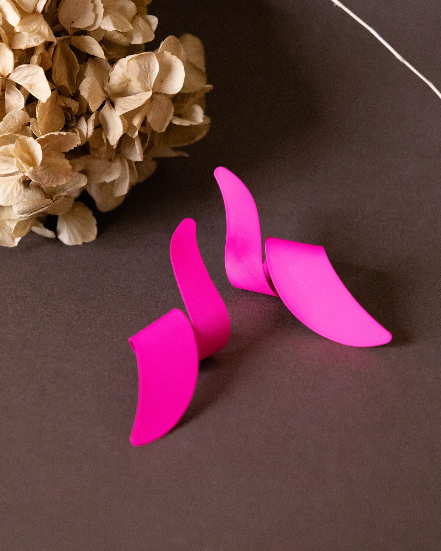 Pink long twisted dangler earrings